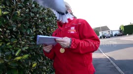 Friendly dove that sits on postman's head