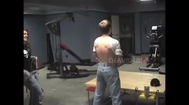 Man getting hit in the back with a jump rope