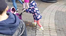 Toddler steps in puddle