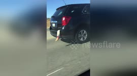 Halloween prankster makes fake leg stick out of SUV