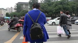 Pedestrians crossing in Chengdu city, China