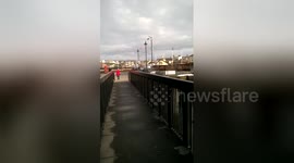 Newsflare Edit - Skydiver narrowly misses streetlight while landing