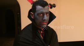 Brother scares baby sister dressed as Dracula