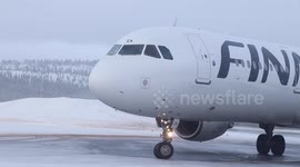 Finnair taking off in the icy runway of Ivalo in Finland