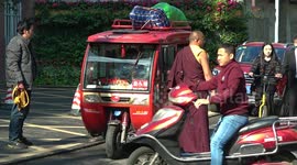 Modern public buses and ancient cabs in China