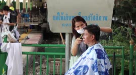 Hairdressers turn train station into salon offering free hair cuts to the poor