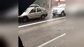 Commuters take shelter from Sao Paulo hailstorm