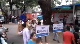 Mumbai man rides horse in ceremonial procession to buy iPhone X