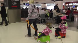 Kids riding their Trunkis at Sydney airport