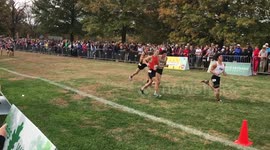 State cross-country runner helps competitor over the line