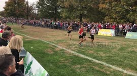 State cross-country runner helps competitor over the line