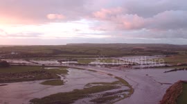 Flooding in small town captured in evening light with drone (aerial filming)