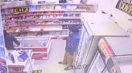 Hero shopkeeper captured on CCTV fighting off crowbar wielding raider with Terminator-style walk