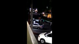 3 men jump a man and hit him with a skateboard