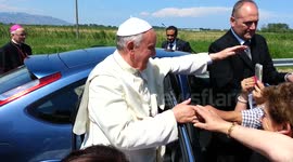 Pope stops to kiss and lay hands on disabled girl