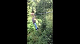 Boy zip wires for the first time, no hands