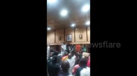 Protesters tear down Mugabe portrait after ruler's resignation