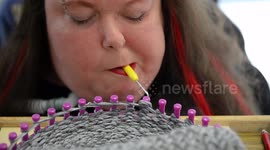 Quadriplegic woman knits with her mouth