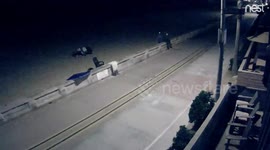 Homeless man loads a huge mountain of stuff onto a rolling office chair.