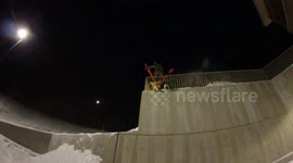 Urban skier accidental flip off of rail