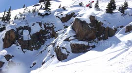 Snowboarder cannonball off cliff