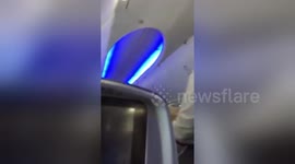 Newsflare Edit - In flight turbulence causes Flight attendant to fall
