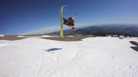 Two skiers, one and a half flips