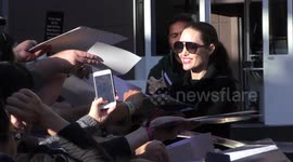 Angelina Jolie greets fans & signs autographs in Hollywood