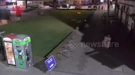 This hilarious CCTV footage shows the moment two teenage girls carried a stolen sculpture of a giant pig through a city centre