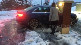 Car stuck in snow storm in Burnaby