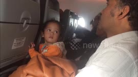 Baby confused on air plane