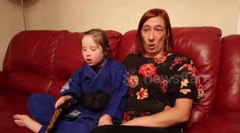 Inspiring eight-year-old who has Down's Syndrome receives black belt in MMA