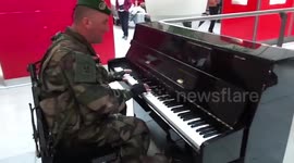 French soldier sings and plays piano at Paris train station