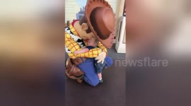 Boy, 2, meets Woody from 'Toy Story' for first time and just won’t let go