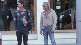 Mickey Rourke shows off his chest tattoos while Christmas shopping with a friend in Beverly Hills
