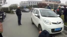 Elderly man blackmails car driver by moonwalking backward to fall down