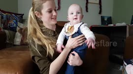 Mum and baby waving to camera