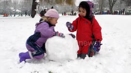 Playing in snow at The Horniman Museum in South London