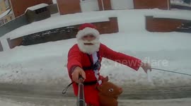 Hilarious moment Santa spreads cheer throughout UK village - on SKIS