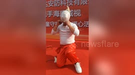 Chinese performer inflates plastic glove with nose