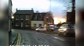 This is the terrifying moment a speeding driver narrowly misses a dog walker after mounting the kerb while undertaking another vehicle