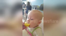 Newsflare Edit - Baby eating lemon first time