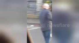 Newsflare Edit - VIDEO: The moment a Big Issue seller punches the air after a passer-by gives him a TV