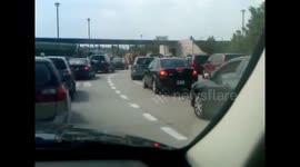 Colleagues laugh at driver struggling with manual car