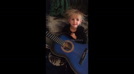 Little girl learning guitar