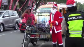 Police wearing santa clothes give free chocolate to road users