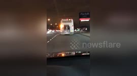 Duo hitch ride on back of bus in Staten Island