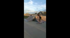 Guy falls off longboard
