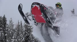 Jumping snowmobile into deep snow