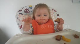 Baby finds pictures of herself too hilarious!